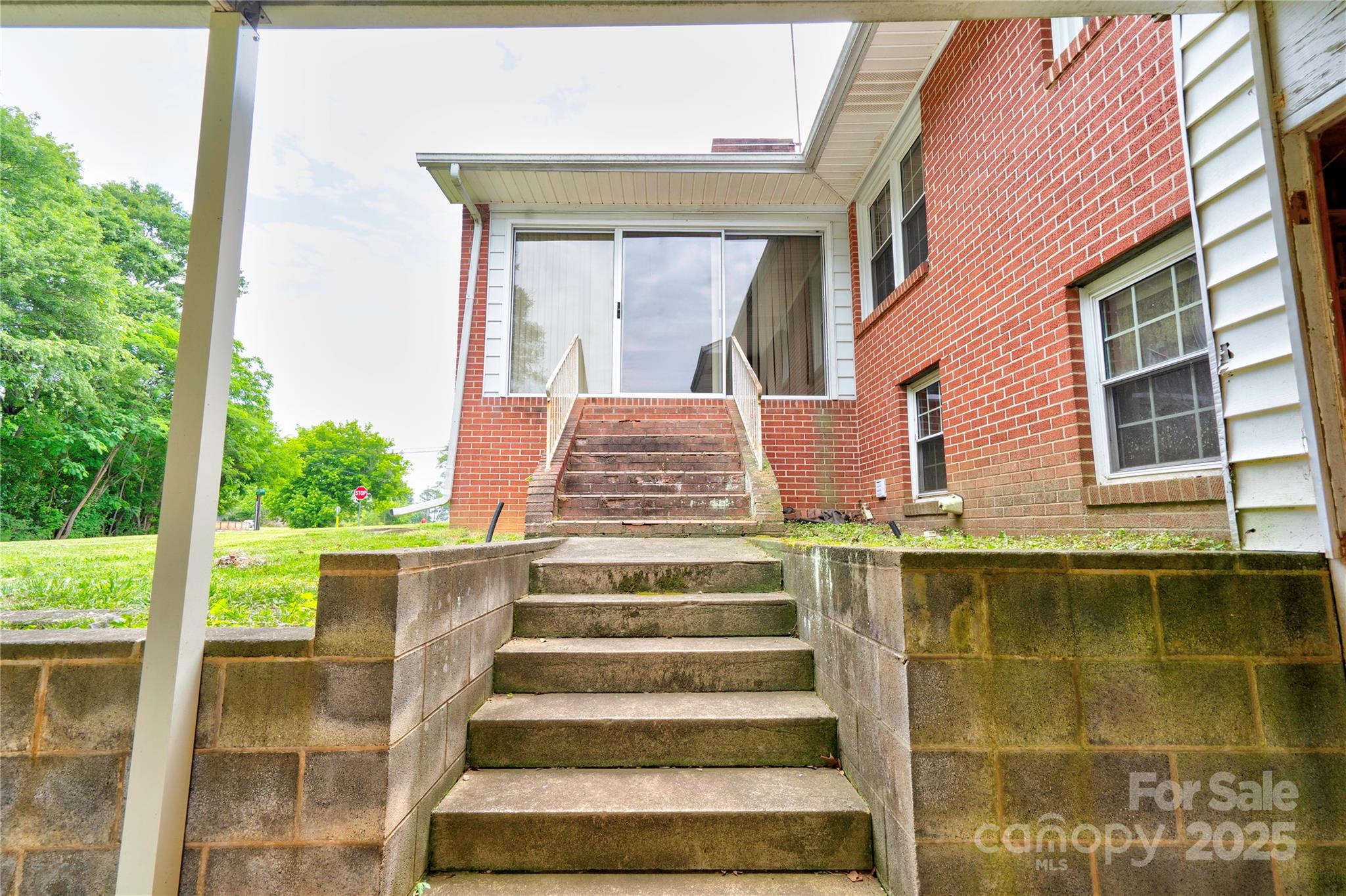 800 Charles Road Shelby, NC 28152 - Photo 8 of 21 a view of a brick house with a large window