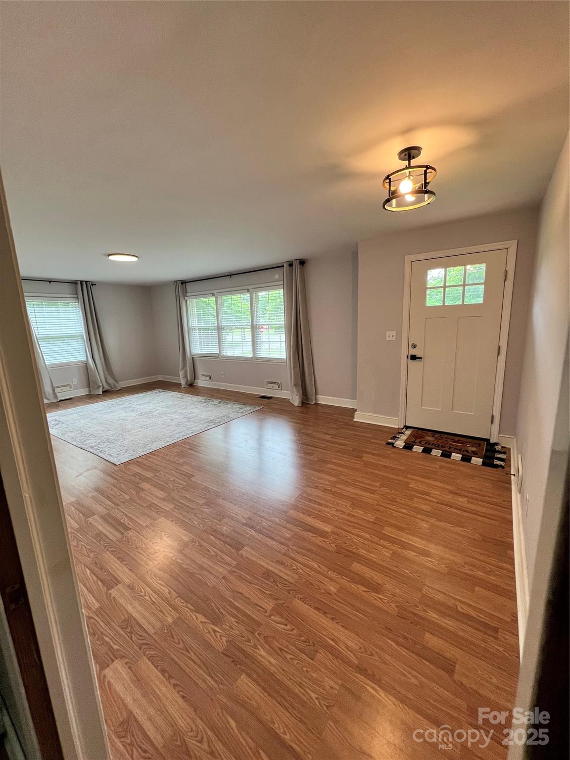 800 Charles Road Shelby, NC 28152 - Photo 9 of 21 wooden floor in an empty room with a window