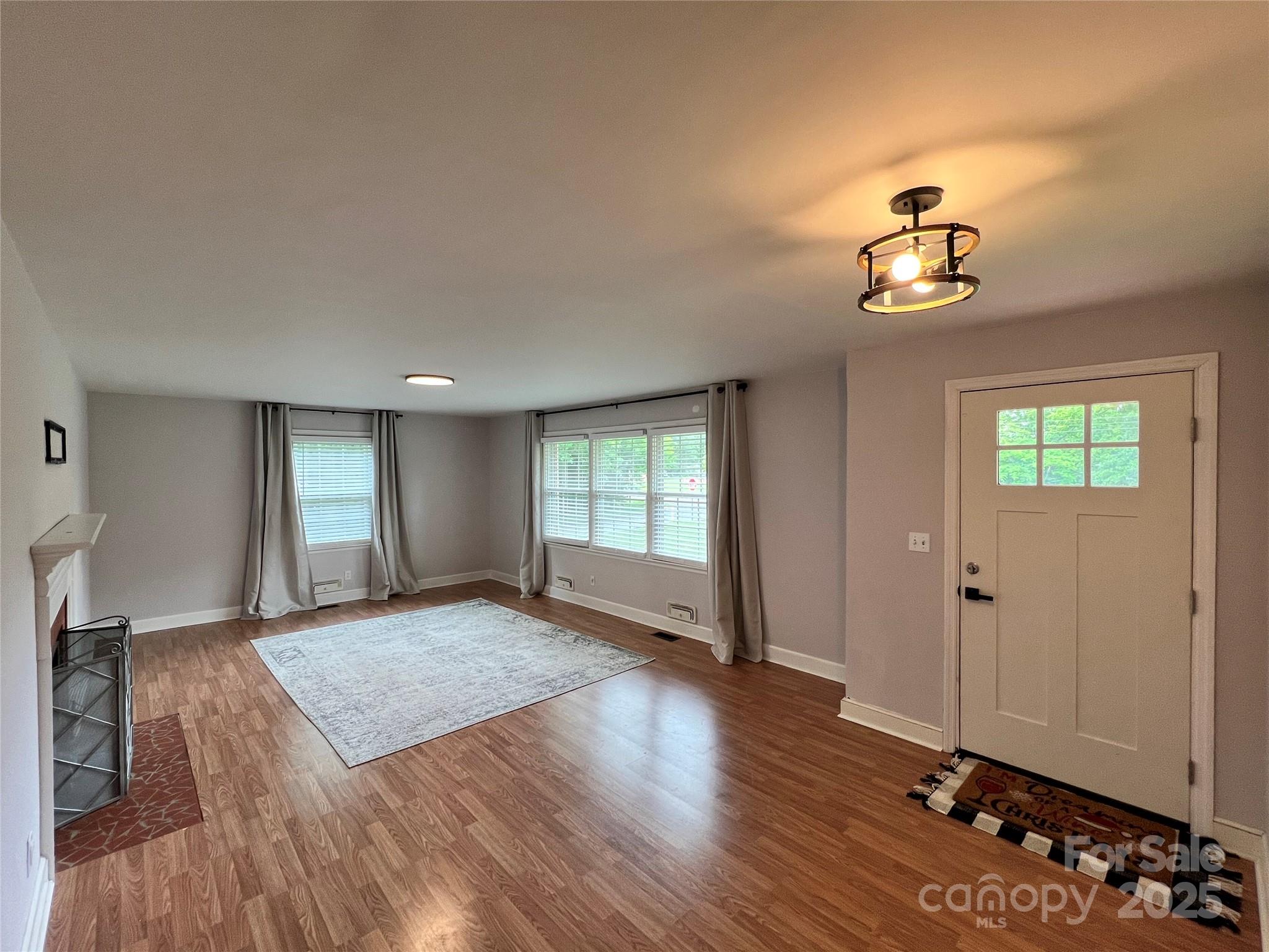 800 Charles Road Shelby, NC 28152 - Photo 10 of 21 wooden floor in an empty room with a window