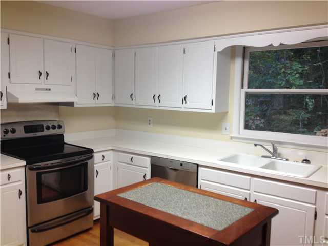 1901 Fountain Ridge Road Chapel Hill, NC 27517 - Photo 4 of 7 a kitchen with a sink cabinets and stainless steel appliances