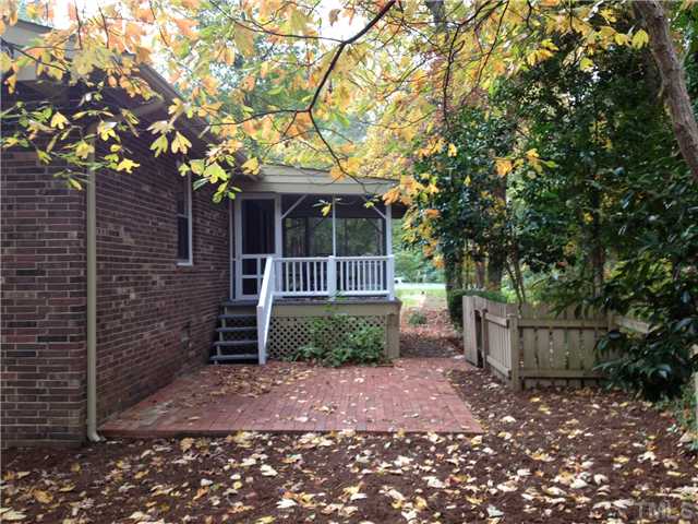 1901 Fountain Ridge Road Chapel Hill, NC 27517 - Photo 6 of 7 a front view of a house with a tree