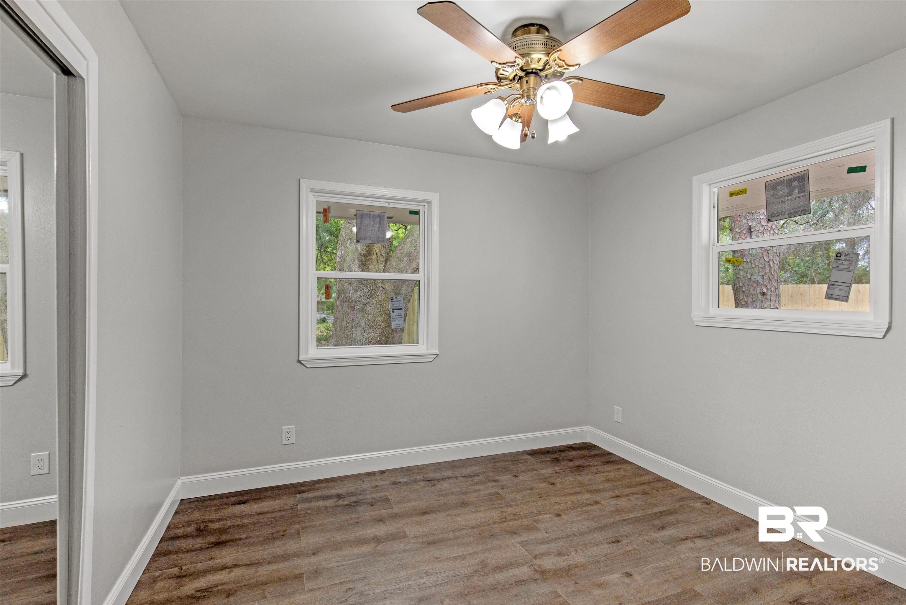 1432 South Polaris Drive Mobile, AL 36693 - Photo 11 of 27 Empty room featuring wood finished floors and ceiling fan