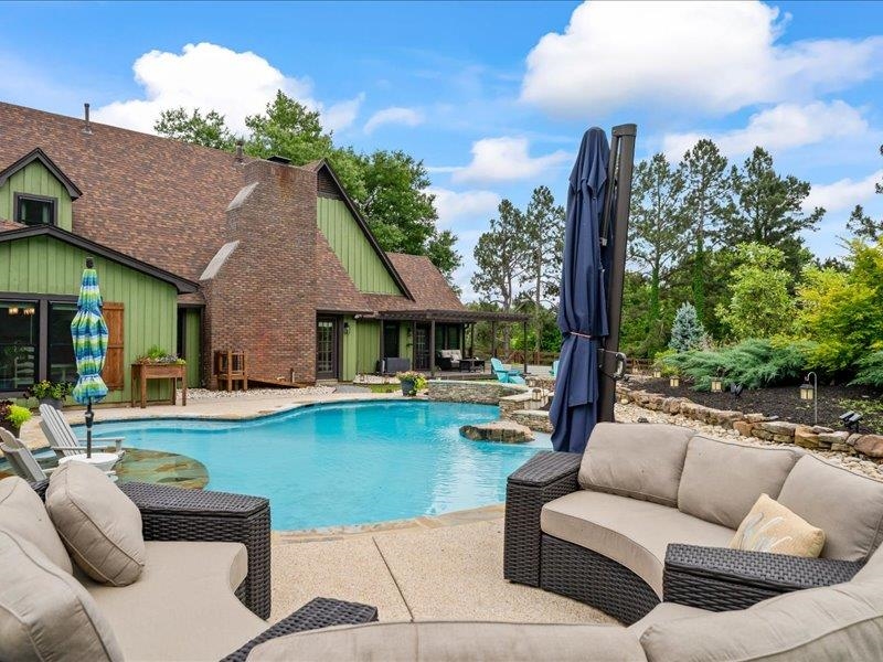 8104 Jack Bond Road Arlington, TN 38002 - Photo 32 of 40 a view of a house with swimming pool and sitting area