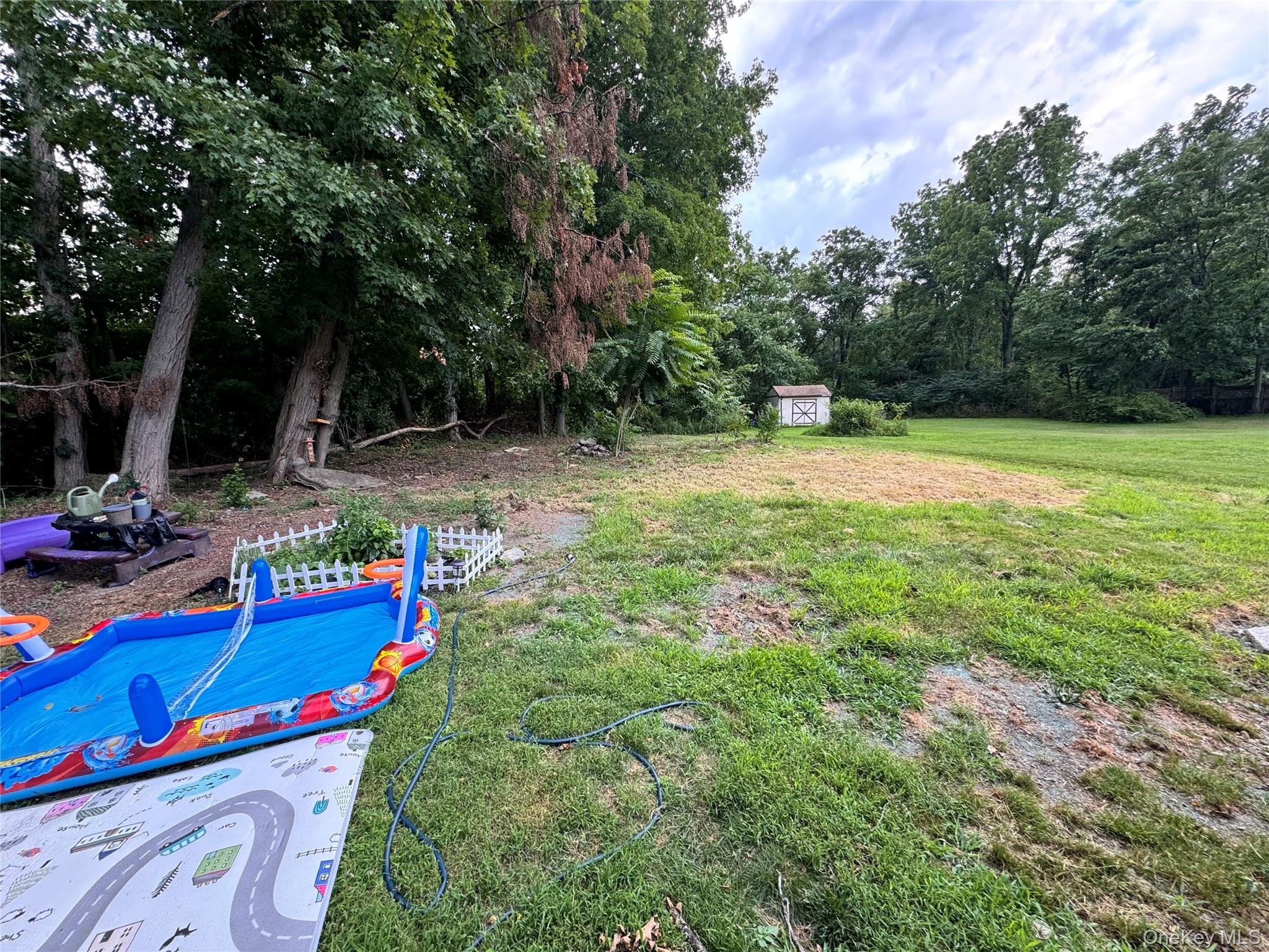 261 Titusville Road Poughkeepsie, NY 12603 - Photo 5 of 18 a view of a backyard with swimming pool