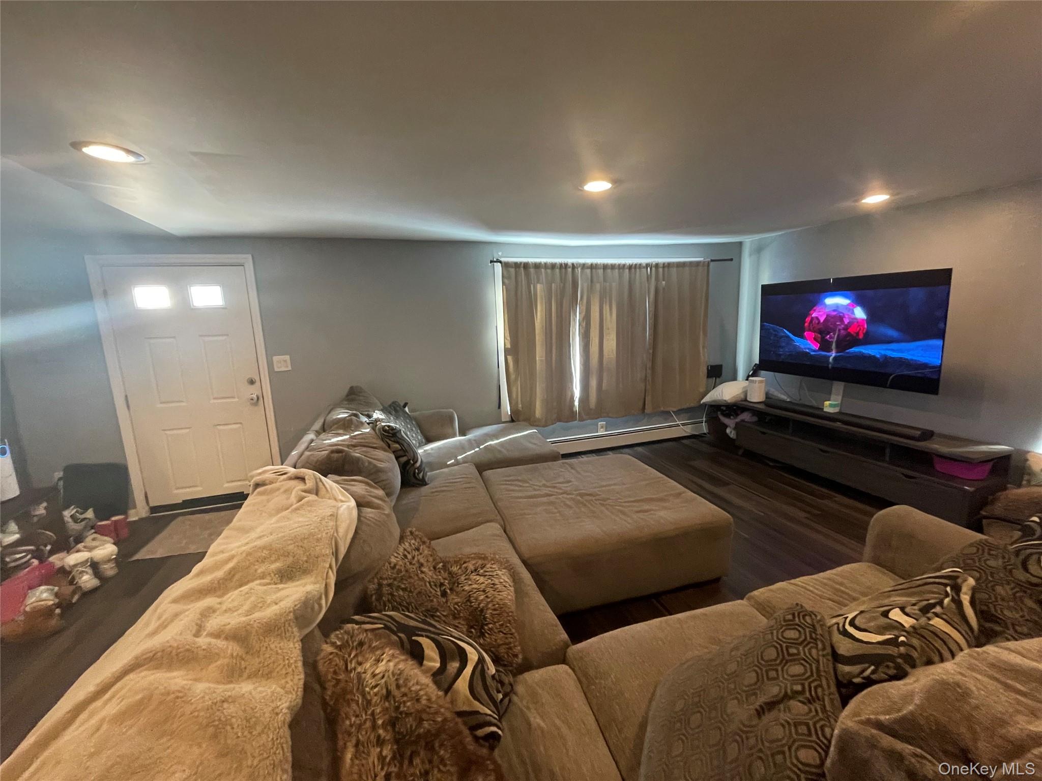 261 Titusville Road Poughkeepsie, NY 12603 - Photo 8 of 18 a living room with furniture and a flat screen tv