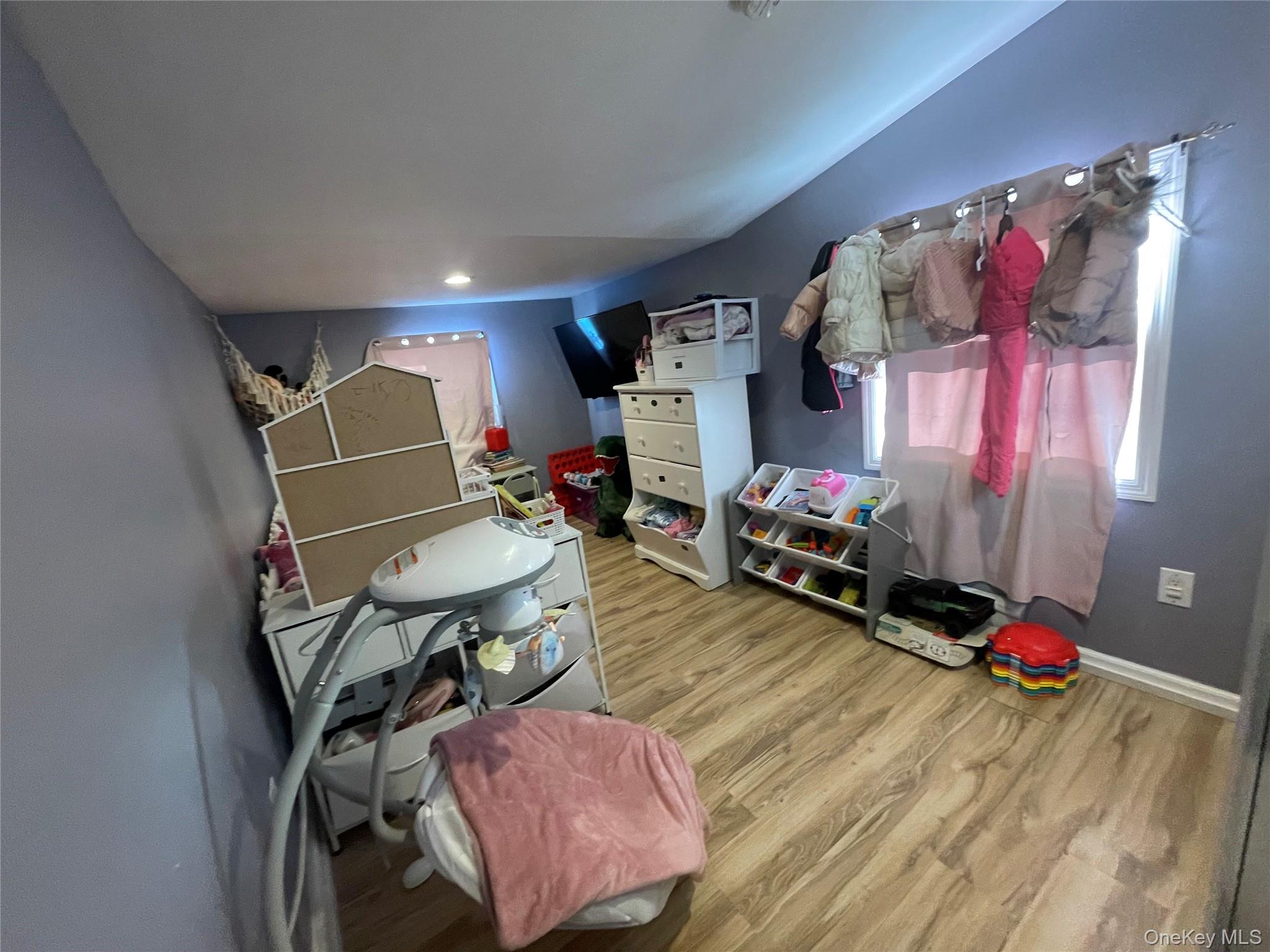 261 Titusville Road Poughkeepsie, NY 12603 - Photo 9 of 18 a room with furniture and a flat screen tv