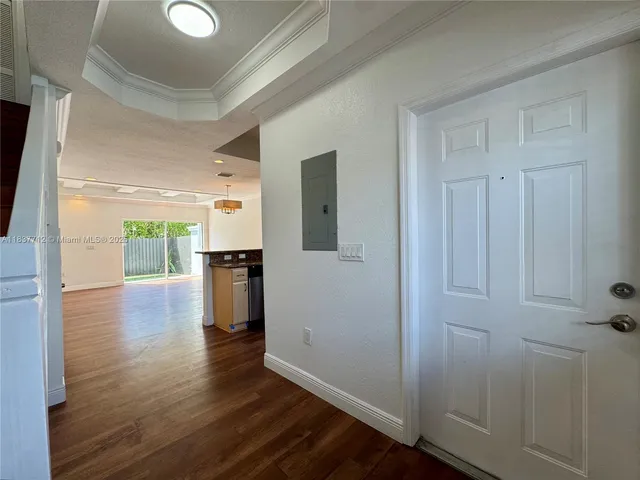 a kitchen with stainless steel appliances kitchen island granite countertop a stove and a wooden floors