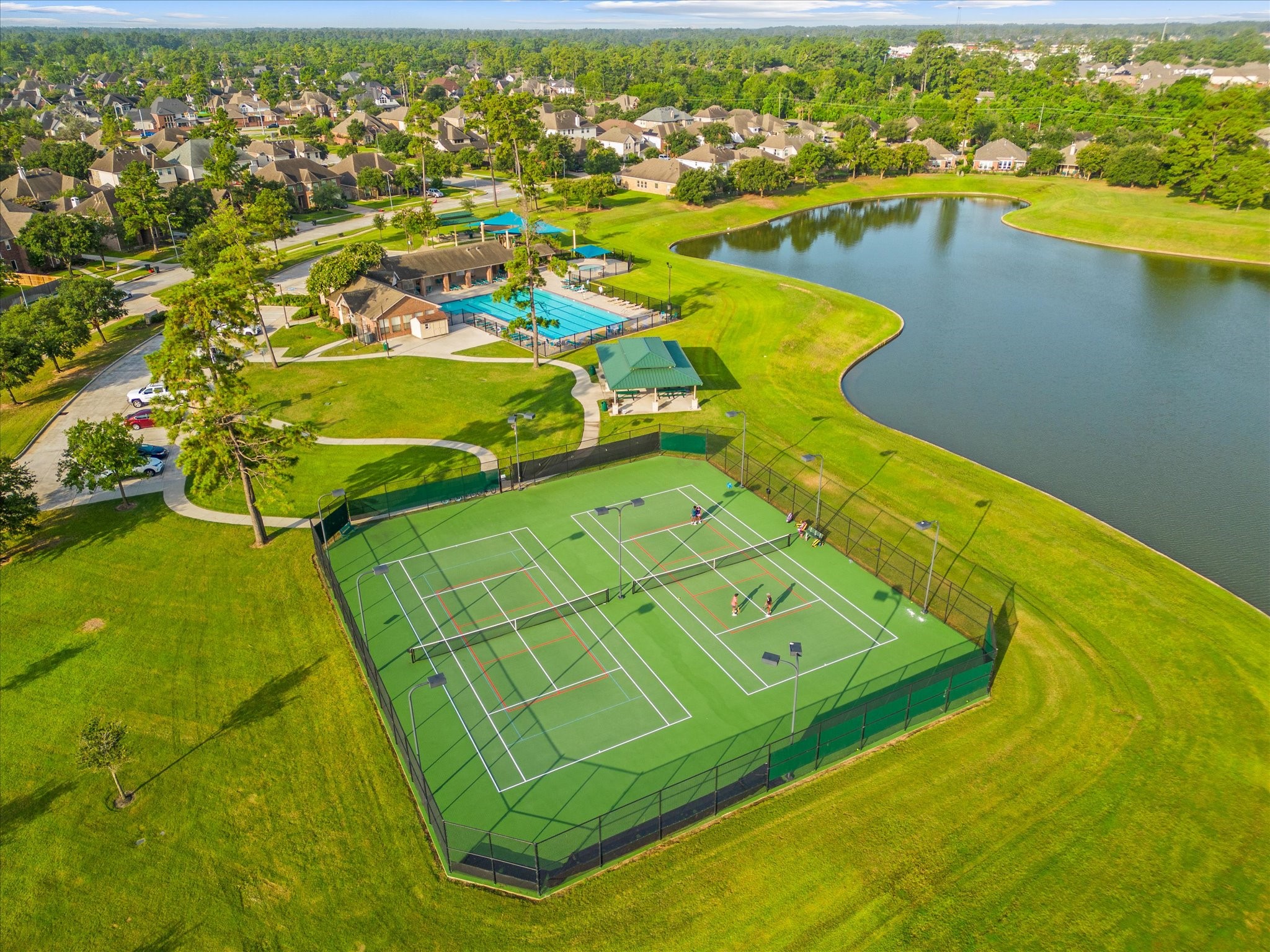13302 Rising Bluff Lane Cypress, TX 77429 - Photo 32 of 38 View of the community cent, pool, lake and courts