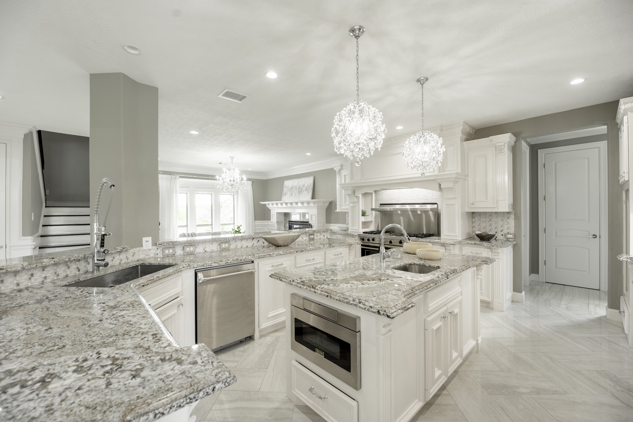10887 Decatur Street Willis, TX 77318 - Photo 15 of 50 a open kitchen with stainless steel appliances granite countertop a stove oven and a sink