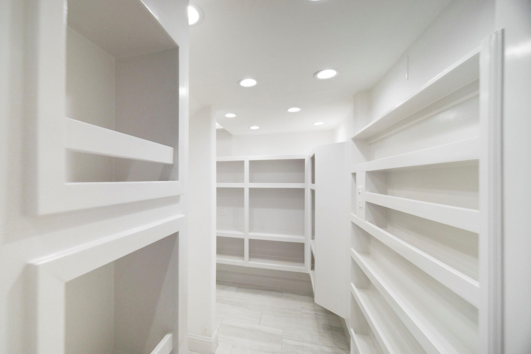 10887 Decatur Street Willis, TX 77318 - Photo 19 of 50 a view of walk in closet with empty racks
