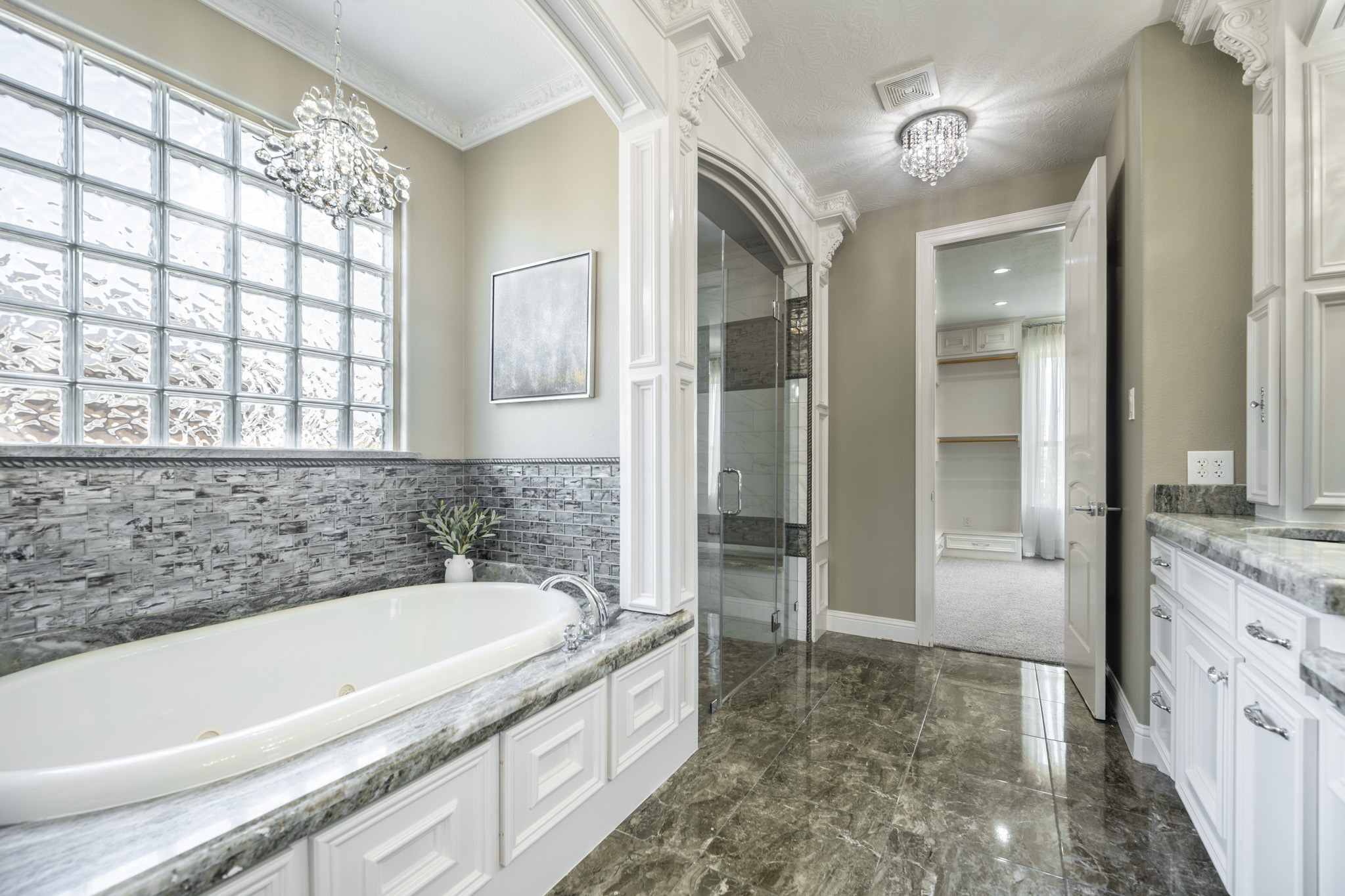 10887 Decatur Street Willis, TX 77318 - Photo 25 of 50 a spacious bathroom with a granite countertop tub sink and mirror