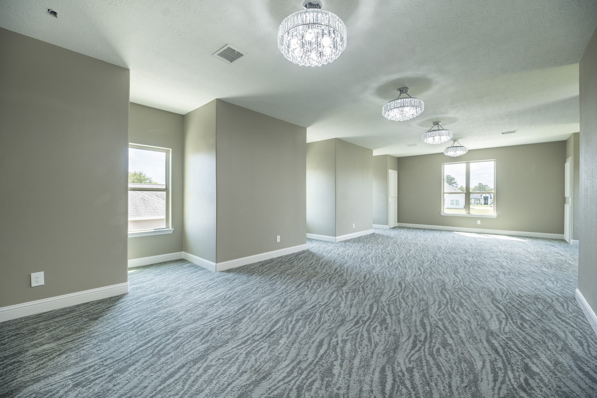 10887 Decatur Street Willis, TX 77318 - Photo 27 of 50 a view of an empty room with a window and wooden floor