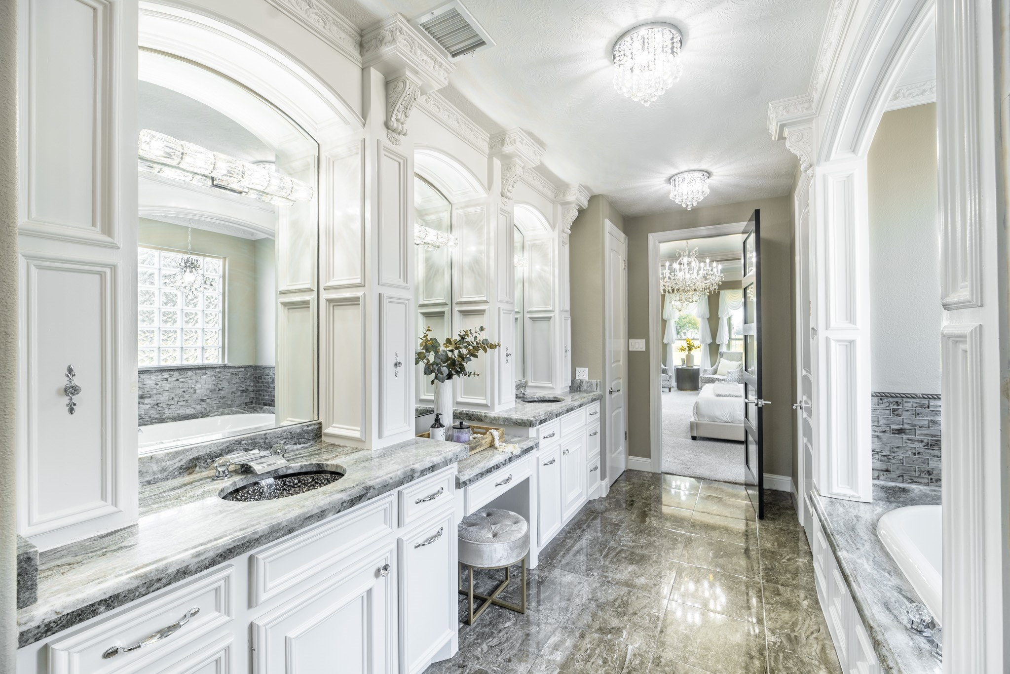 10887 Decatur Street Willis, TX 77318 - Photo 28 of 50 a spacious bathroom with a granite countertop sink and a large mirror