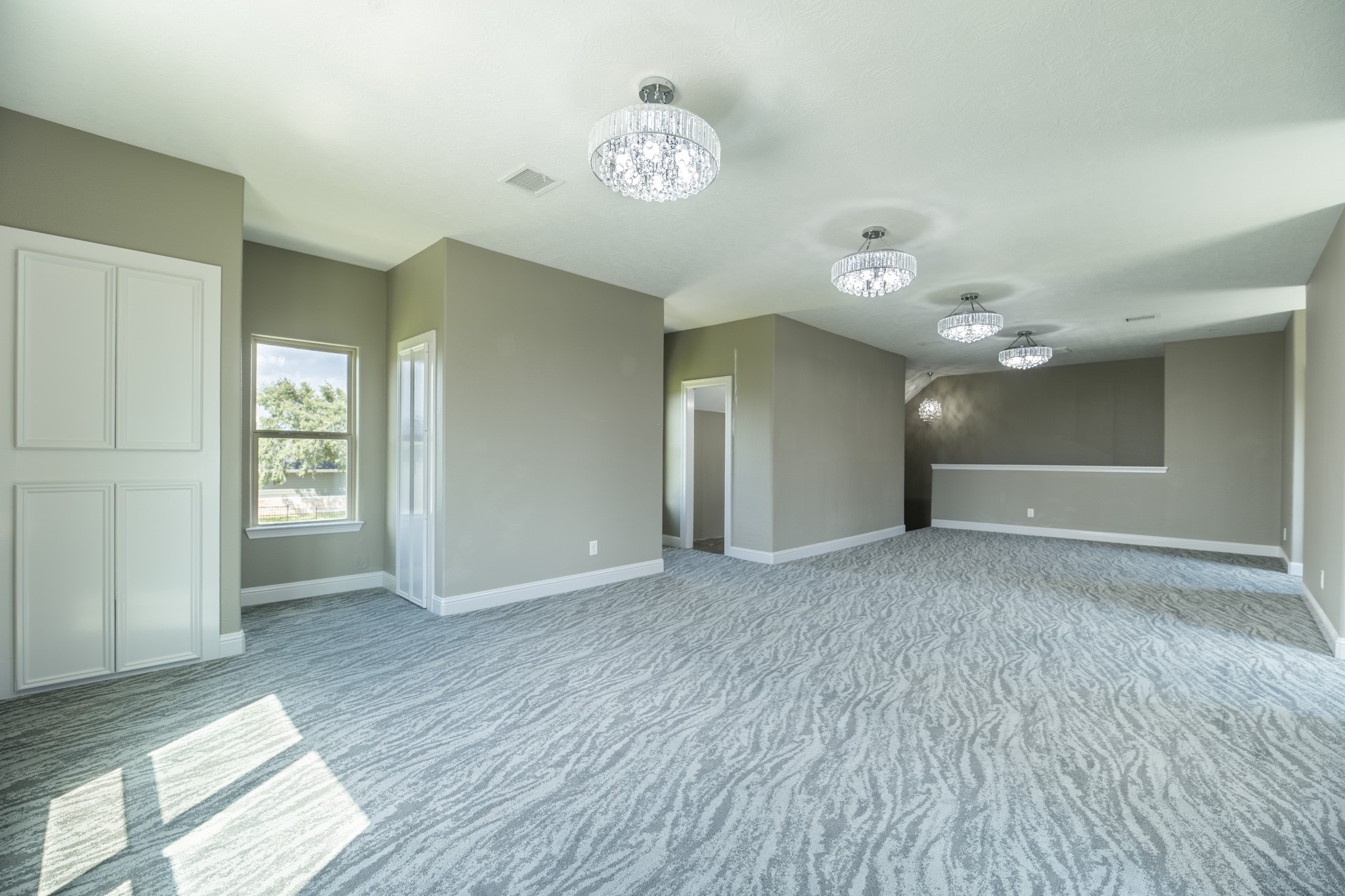 10887 Decatur Street Willis, TX 77318 - Photo 32 of 50 a view of an empty room with window and wooden floor