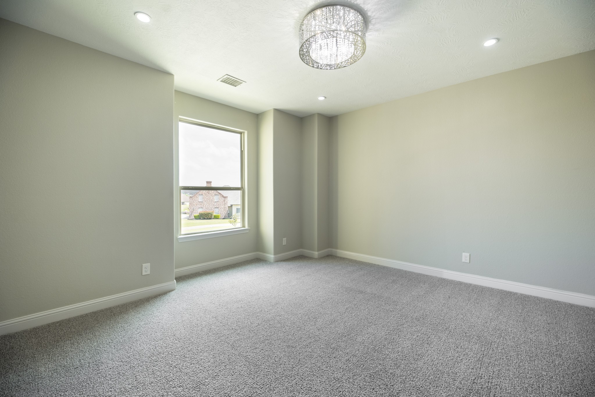 10887 Decatur Street Willis, TX 77318 - Photo 34 of 50 an empty room with a window