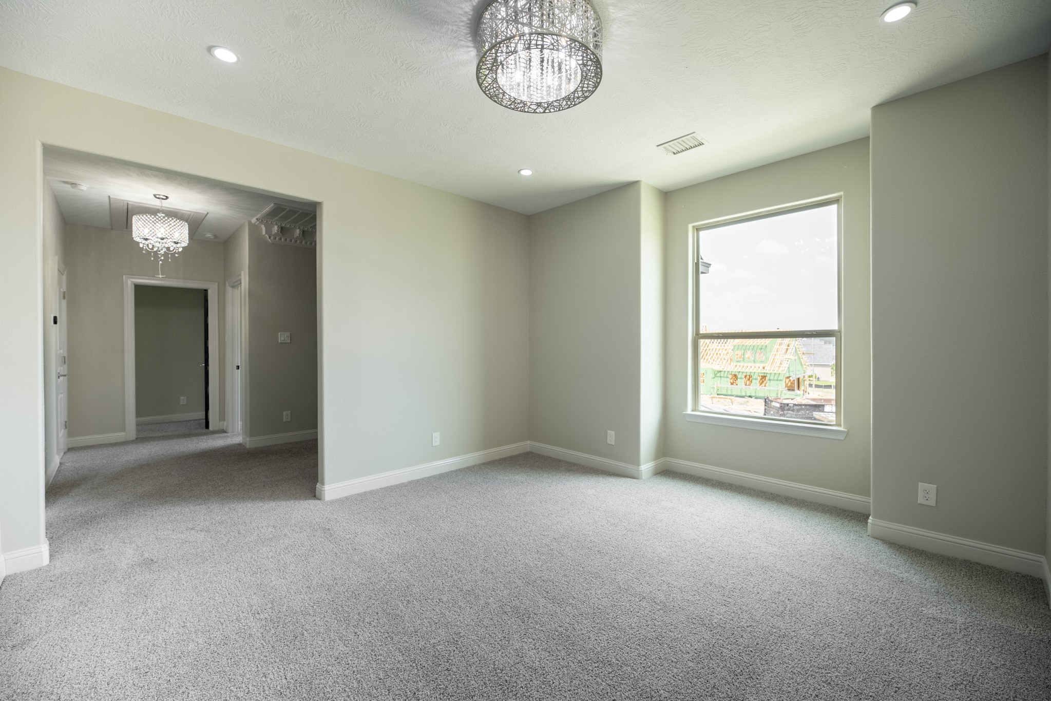 10887 Decatur Street Willis, TX 77318 - Photo 35 of 50 an empty room with a window and a mirror