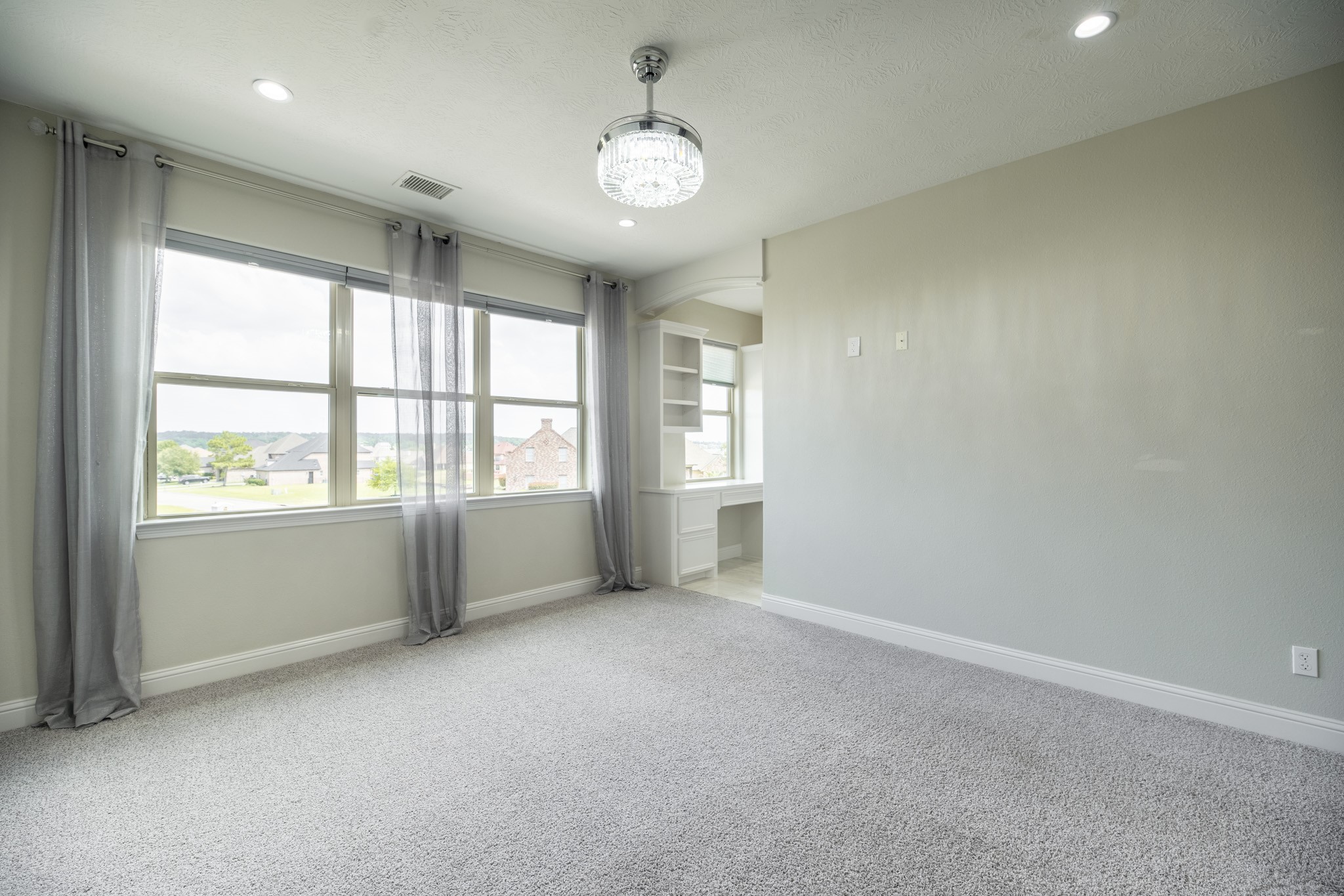 10887 Decatur Street Willis, TX 77318 - Photo 37 of 50 a view of an empty room with a window