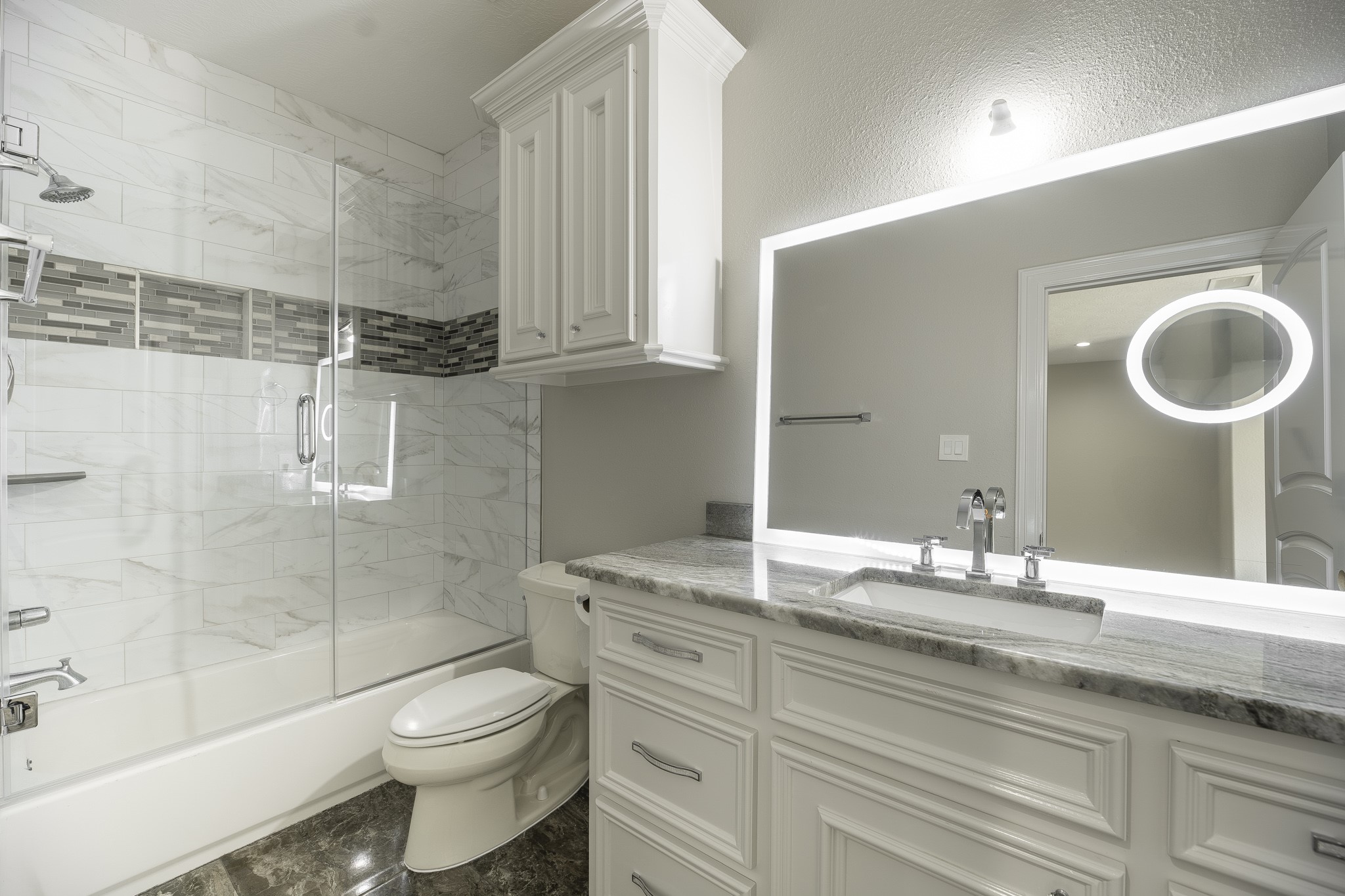 10887 Decatur Street Willis, TX 77318 - Photo 42 of 50 a bathroom with a granite countertop sink toilet and shower