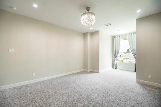 a view of an empty room and a window