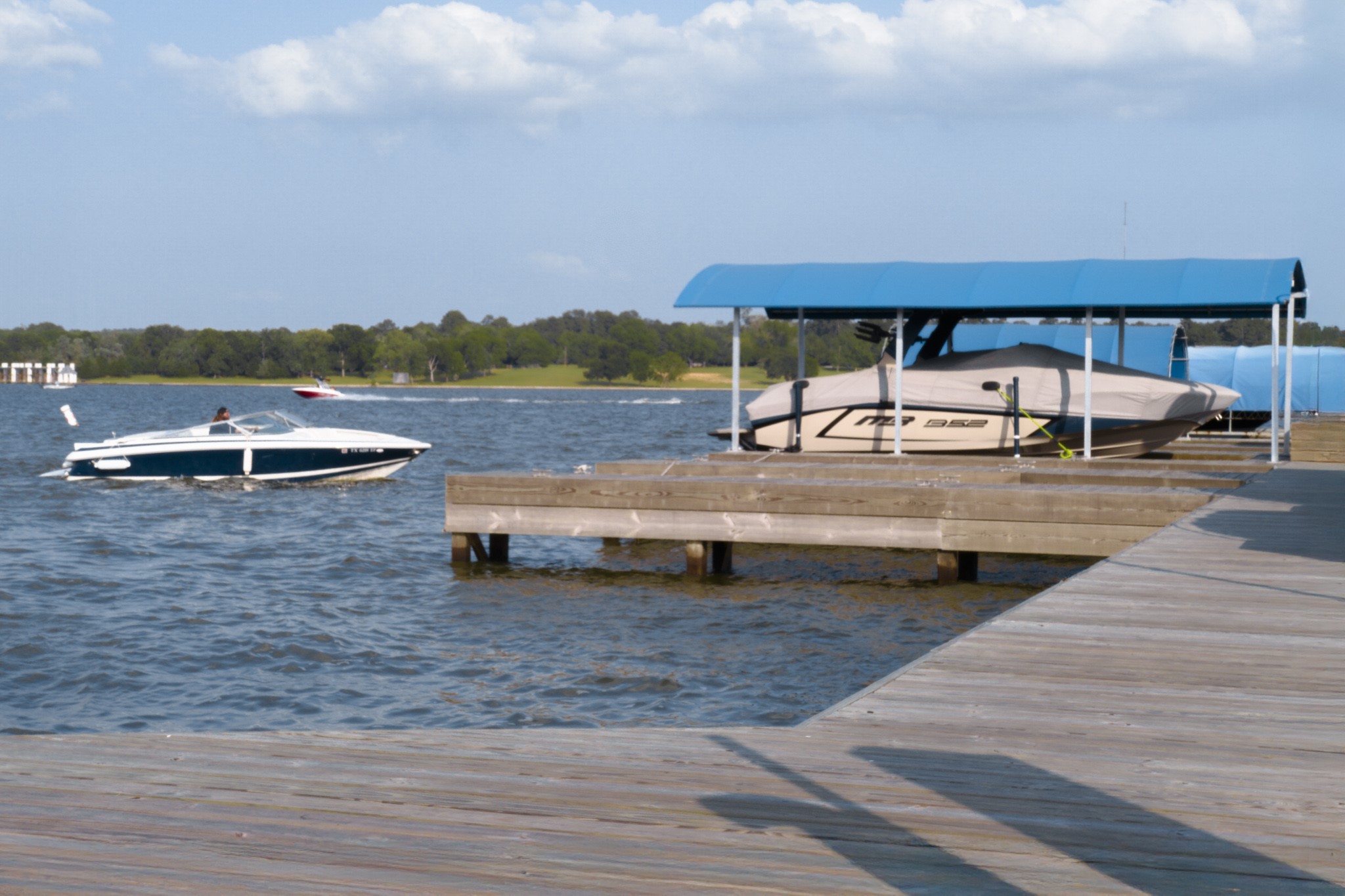 10887 Decatur Street Willis, TX 77318 - Photo 50 of 50 a view of swimming pool with seating area and lake view