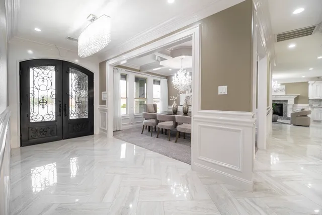 a view of a lobby with a furniture and a mirror