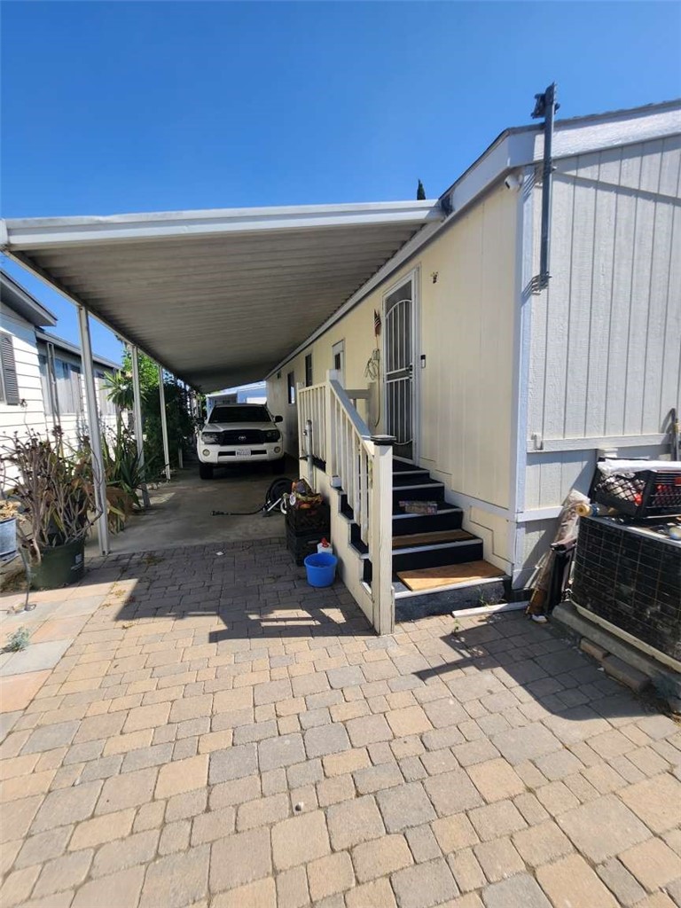 1855 East Riverside Drive, Unit 388 Ontario, CA 91761 - Photo 3 of 17 a view of entryway with a front door
