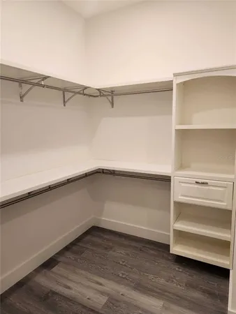a view of an empty walk in closet
