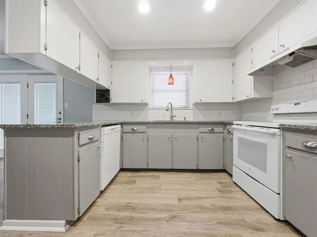 a view of kitchen with wooden floor and window