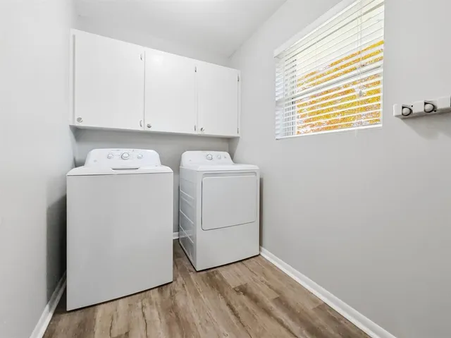 a bathroom with a granite countertop sink a toilet and bathtub