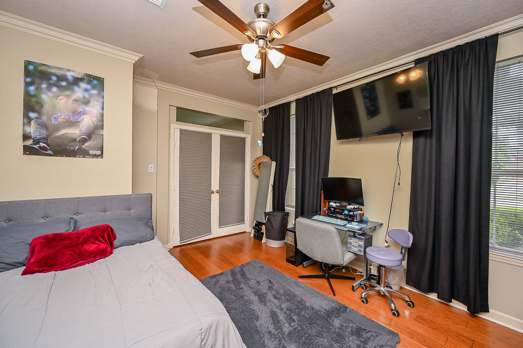17518 Rustling Aspen Lane Houston, TX 77095 - Photo 13 of 39 a bedroom with a bed and dresser with chair