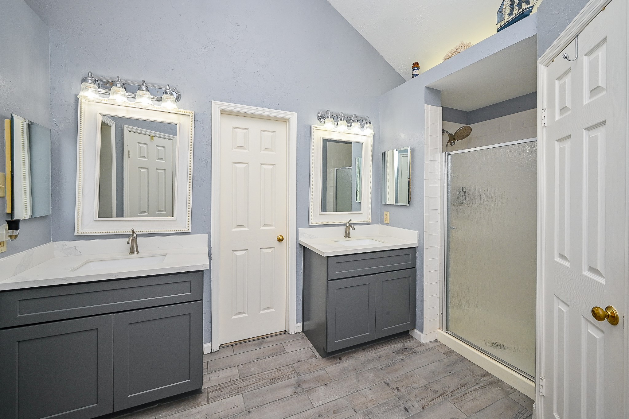 17518 Rustling Aspen Lane Houston, TX 77095 - Photo 26 of 39 a bathroom with a double vanity sink mirror and shower