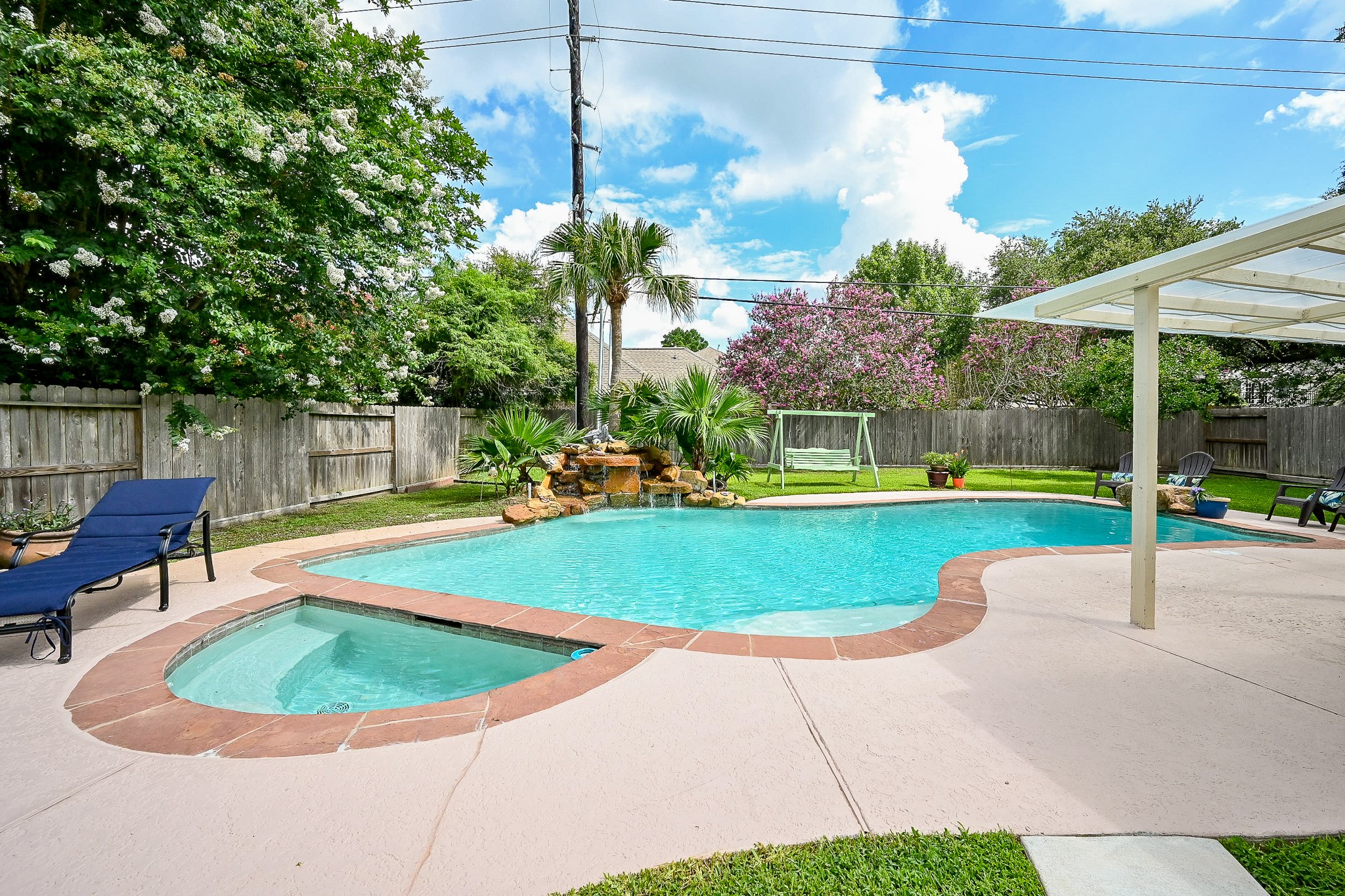 17518 Rustling Aspen Lane Houston, TX 77095 - Photo 36 of 39 a view of a swimming pool with a patio