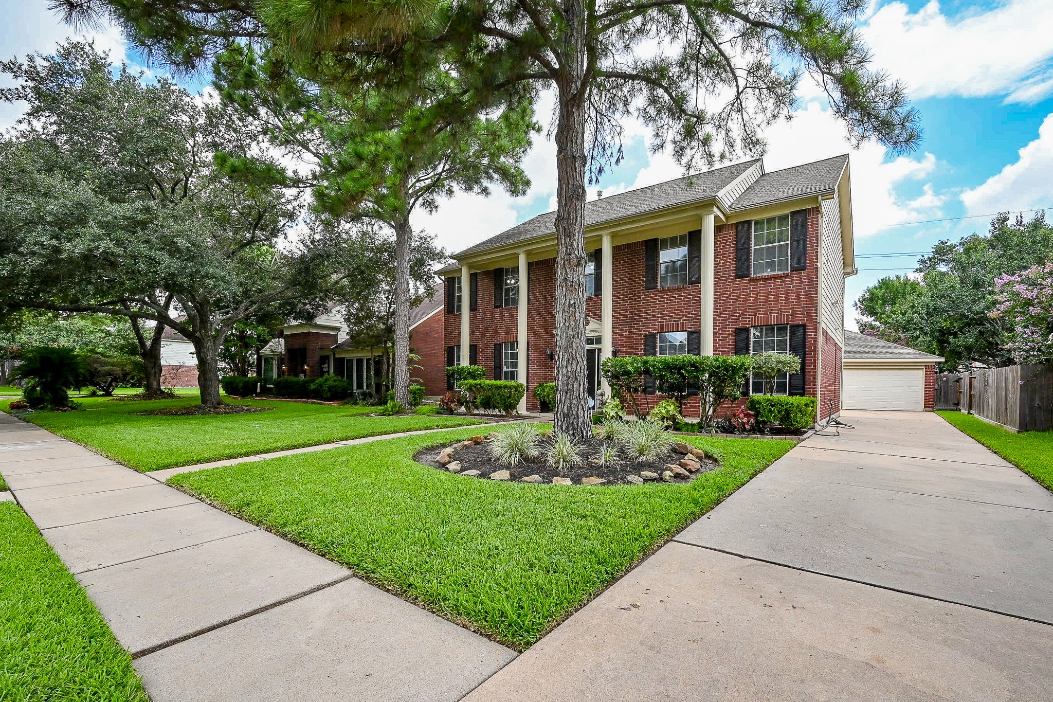 17518 Rustling Aspen Lane Houston, TX 77095 - Photo 39 of 39 a front view of a house with garden