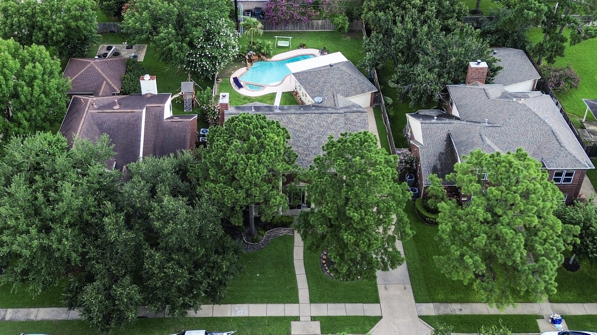 17518 Rustling Aspen Lane Houston, TX 77095 - Photo 4 of 39 an aerial view of a house with a yard and garden