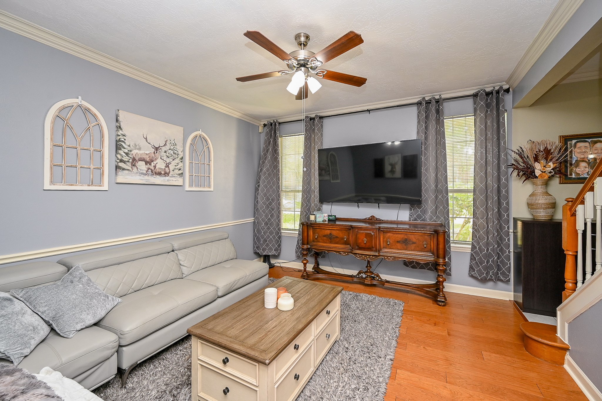 17518 Rustling Aspen Lane Houston, TX 77095 - Photo 7 of 39 a living room with furniture and a flat screen tv