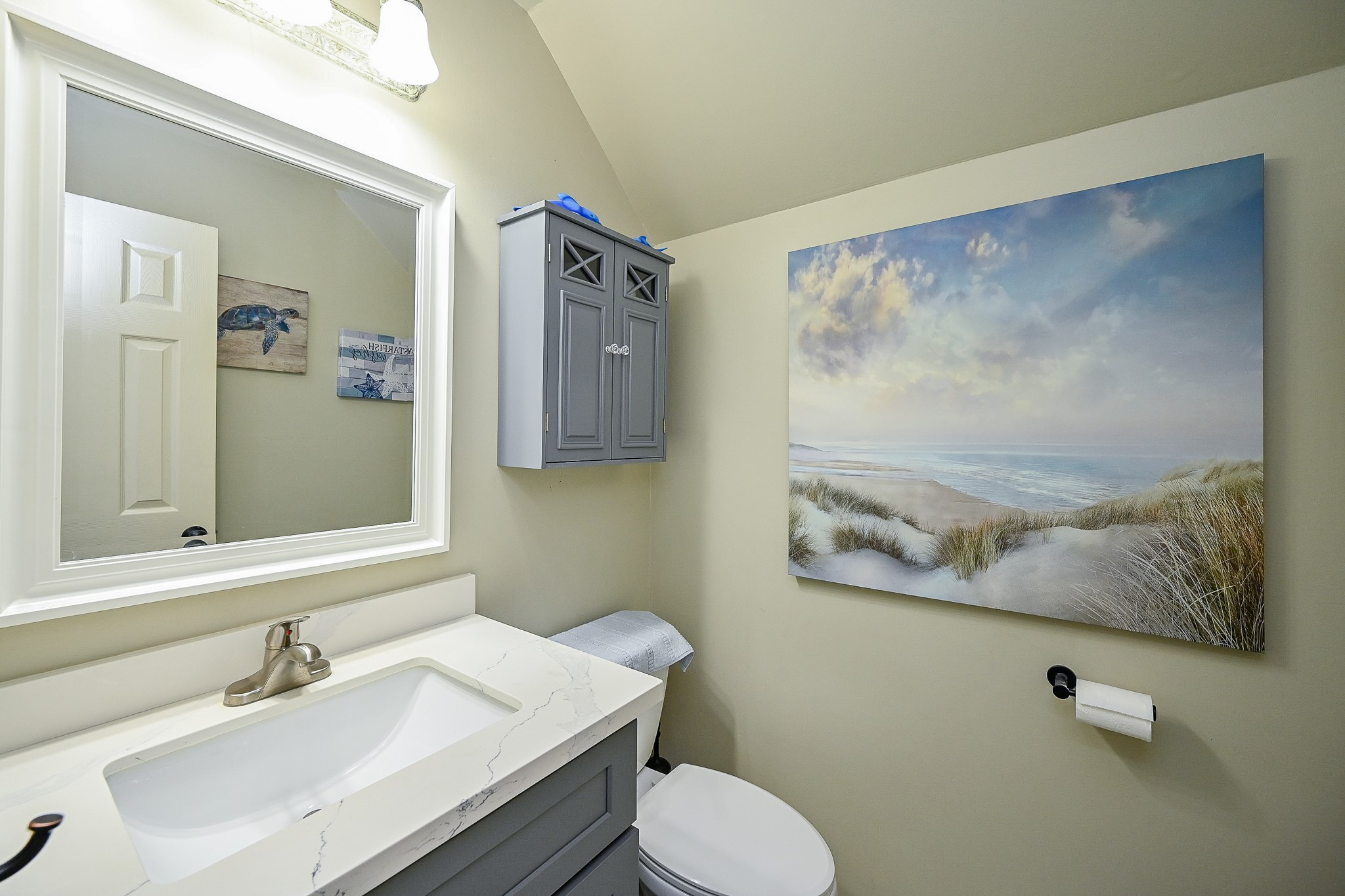17518 Rustling Aspen Lane Houston, TX 77095 - Photo 9 of 39 a bathroom with a sink mirror and a toilet