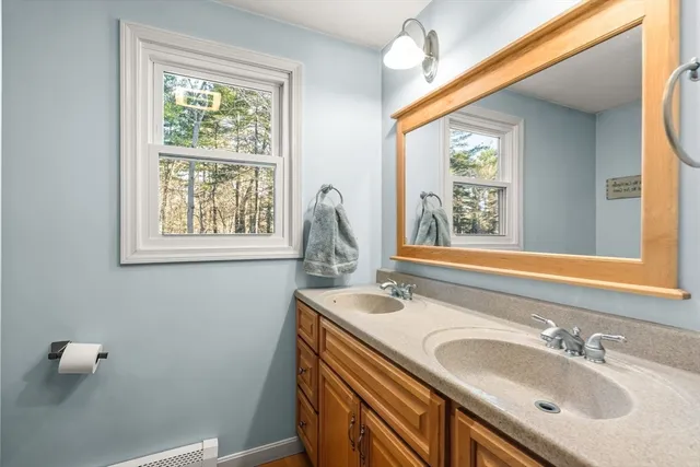 a bathroom with a sink and a window