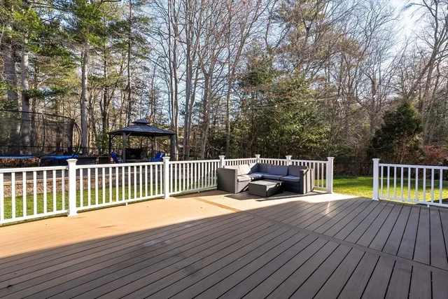 a view of balcony with deck and wooden floor