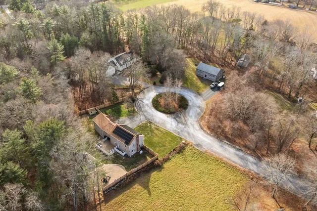 an aerial view of house with yard
