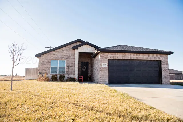 a living room with furniture kitchen view and a chandelier