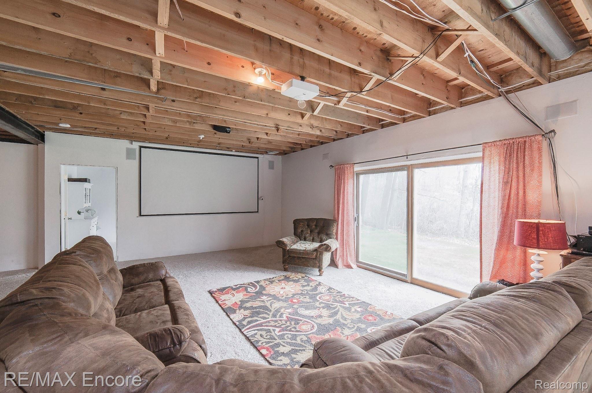 9785 Oakhill Road Holly, MI 48442 - Photo 33 of 43 Projector and surround sound system stay!