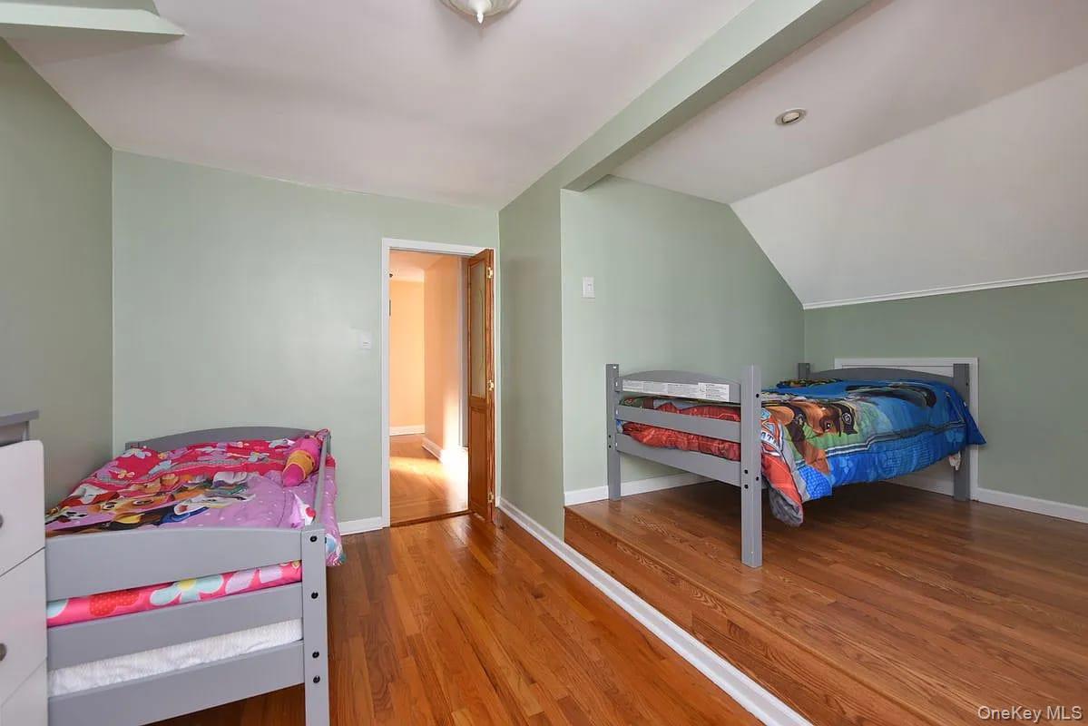 108-30 67th Avenue Queens, NY 11375 - Photo 18 of 29 a bedroom with a bed and a dresser