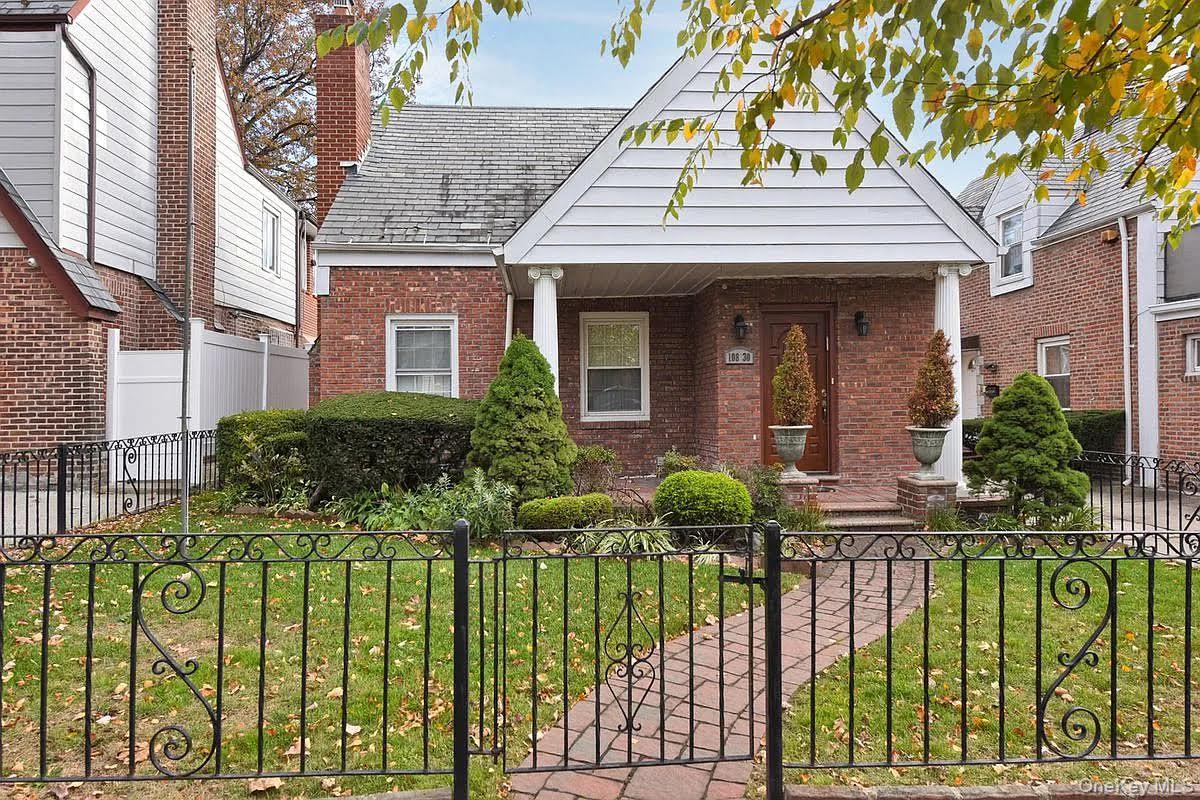 108-30 67th Avenue Queens, NY 11375 - Photo 25 of 29 a front view of a house with a garden