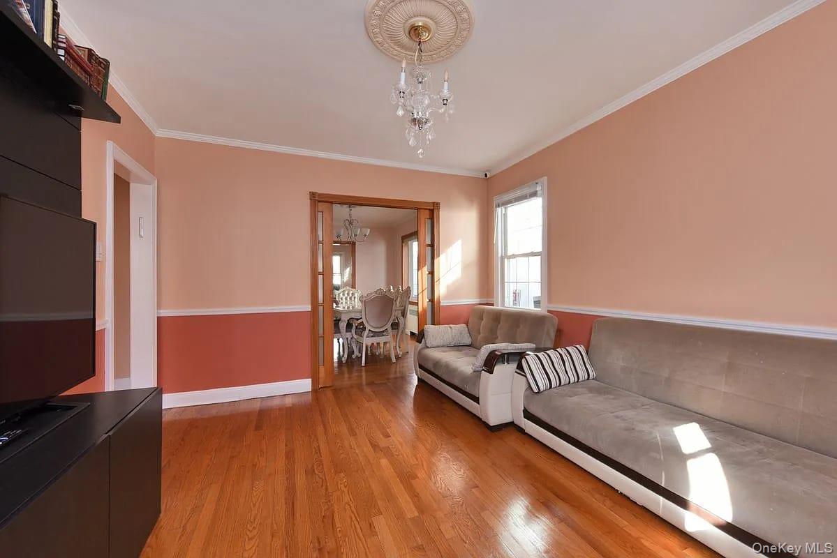 108-30 67th Avenue Queens, NY 11375 - Photo 10 of 29 a living room with furniture and window