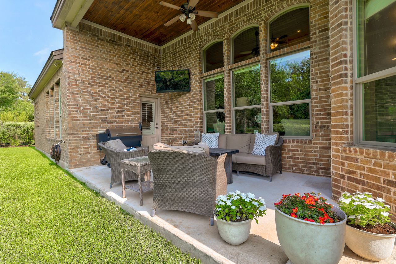 809 Prairie Dunes Drive Georgetown, TX 78628 - Photo 36 of 40 An inviting covered patio with brick exterior and ample seating awaits outdoor gatherings.