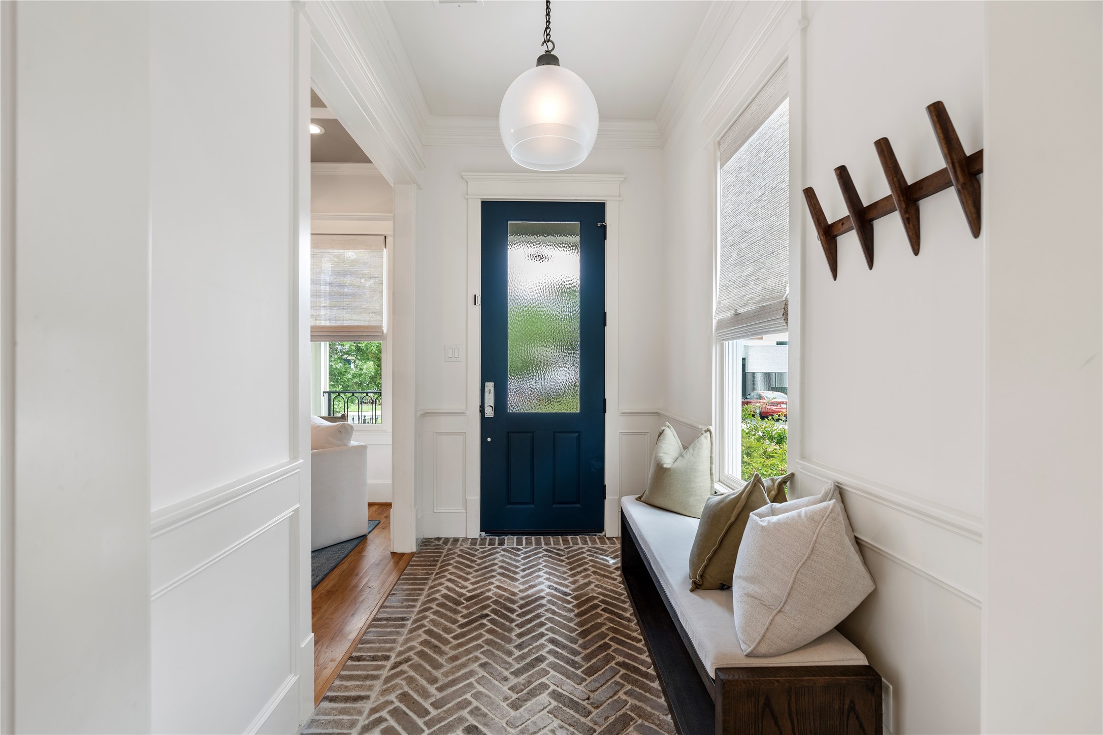 925 Tulane Street, Unit A Houston, TX 77008 - Photo 8 of 49 Welcome guests under a designer pendant while handsome casing and wainscoting nod to the elegant finishes found throughout the home.