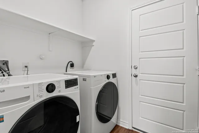 a utility room with dryer and washer