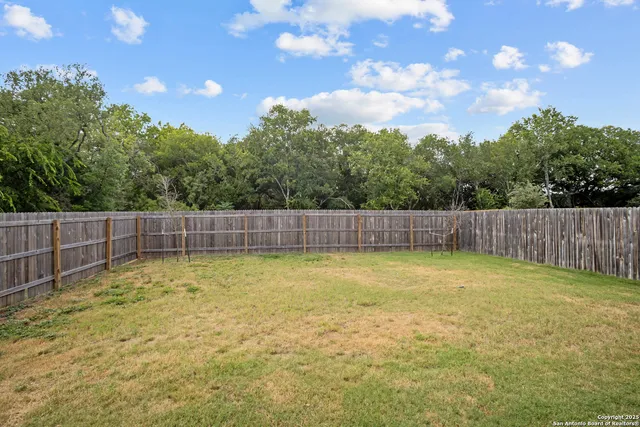 a swimming pool with wooden fence