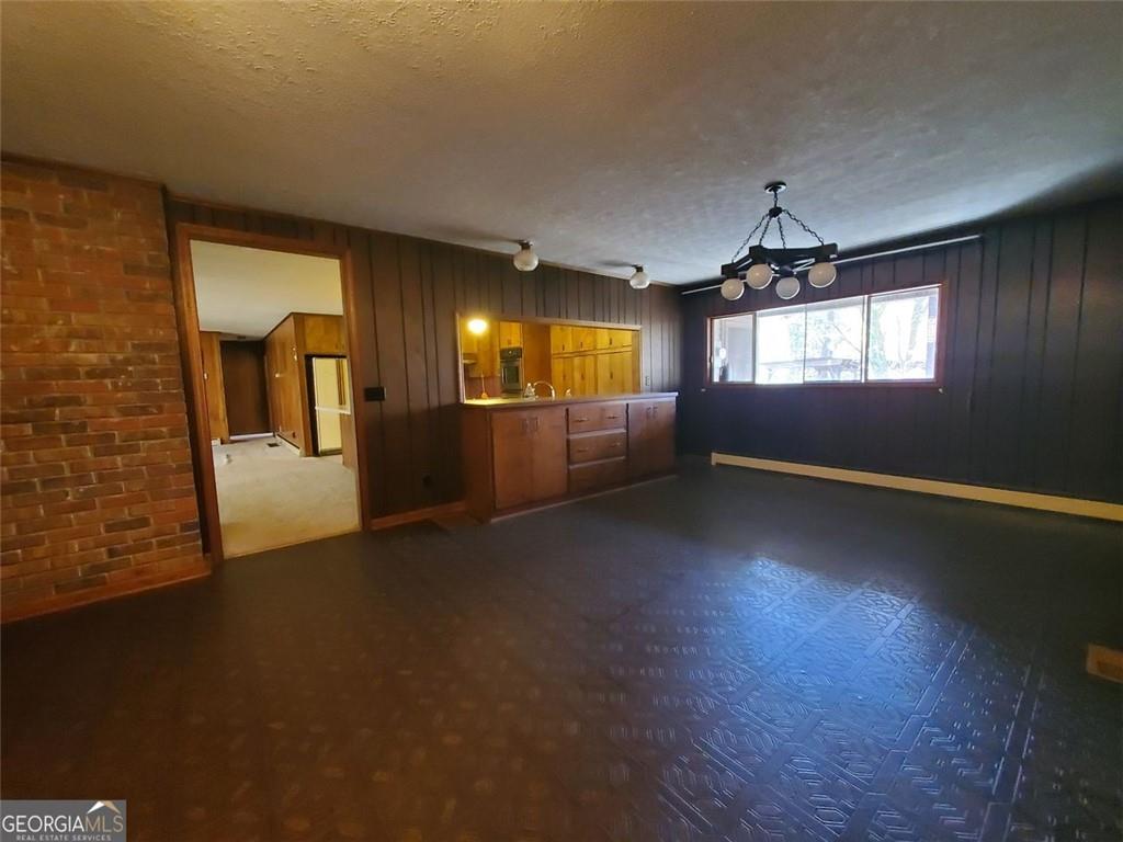 1116 Cody Road Mount Airy, GA 30563 - Photo 19 of 39 an empty room with windows and fireplace