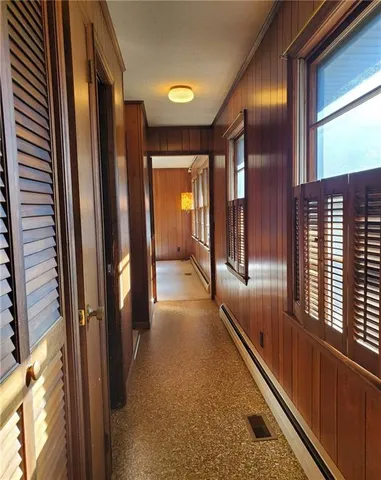 a large kitchen with stainless steel appliances a large counter top